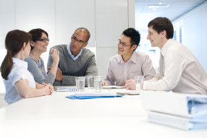group of employees sitting at a table