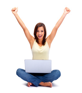 Happy young business woman using a laptop on whit