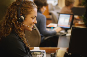 Woman Wearing Phone Headset in an Office